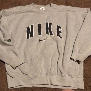 A large grey nike sweater